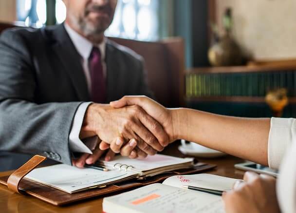 Lawyer and their client shaking hands